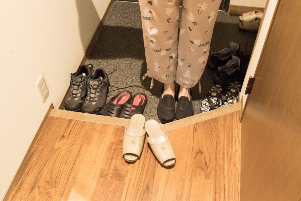 Wearing slippers.